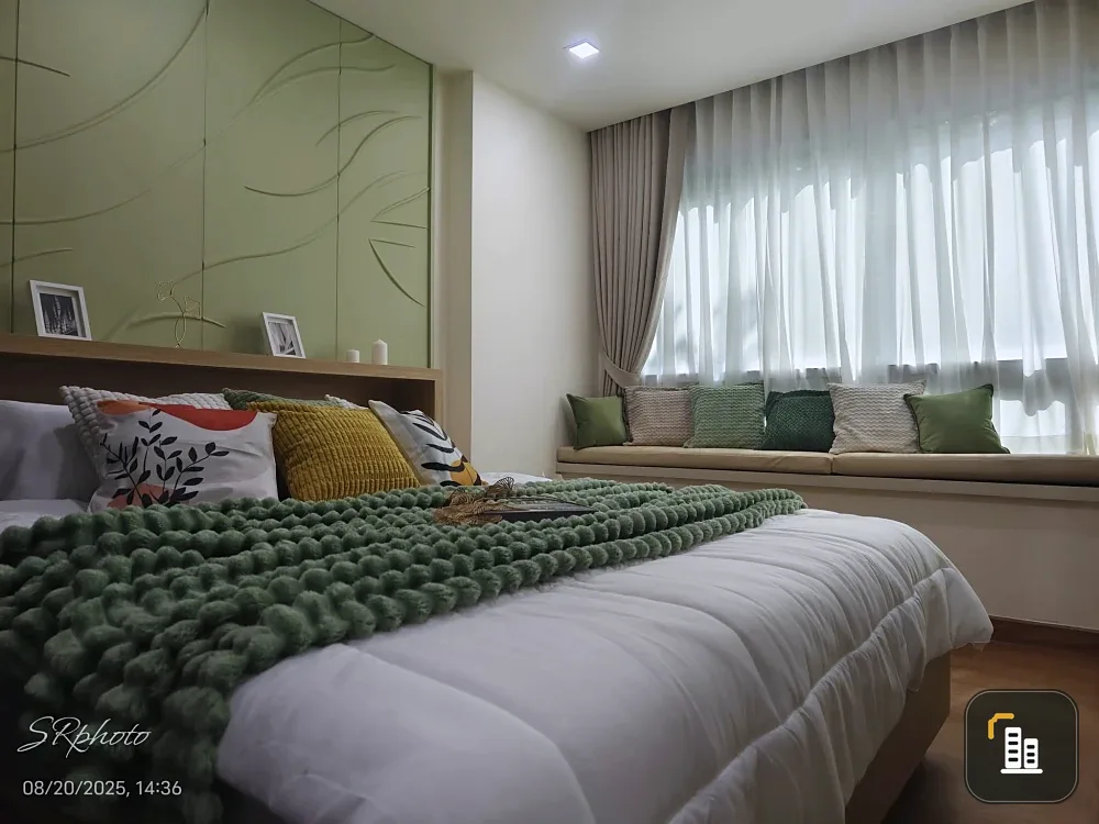 Happy Condo Ladprao 101 for sale, a room with a soothing green tone, fully furnished with built-in furniture and a kitchen set. Reserve now!