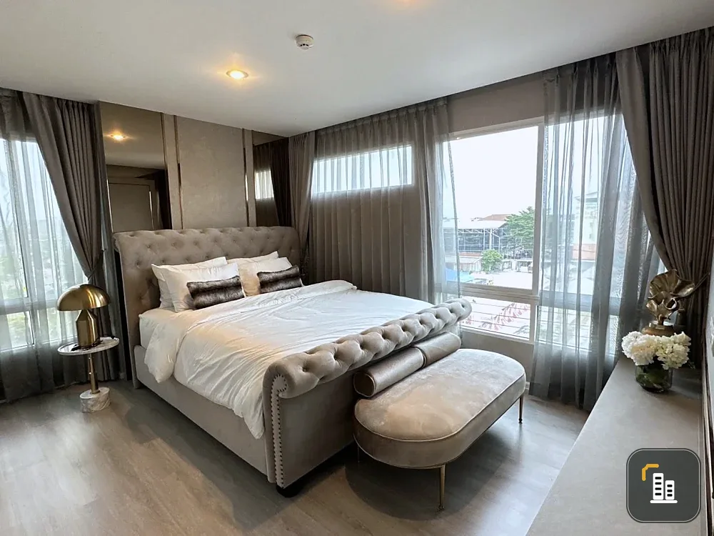 For sale or rent: Happy Condo Ladprao 101. Fully furnished unit with spacious living area, 4th floor, pool view, and large balcony. Book now!