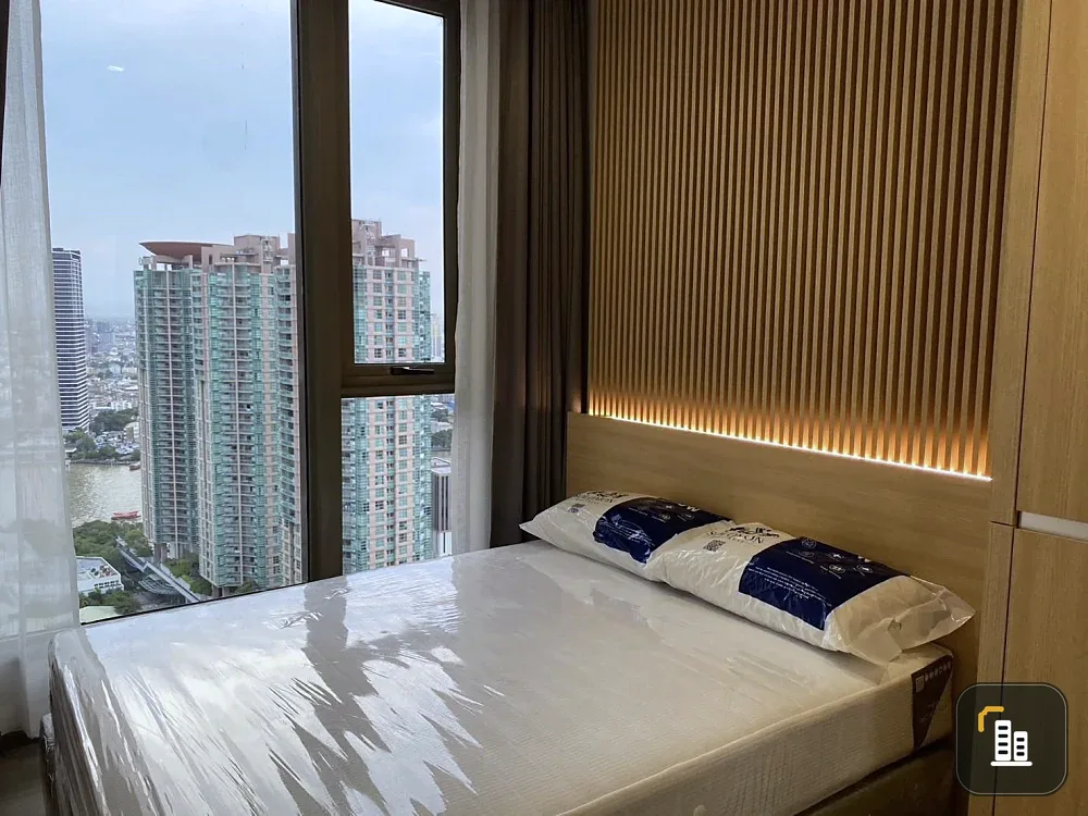 For sale or rent: Rhythm Charoenkrung Pavilion. Very high floor unit with Chao Phraya River view. Beautifully decorated. Don't miss out!