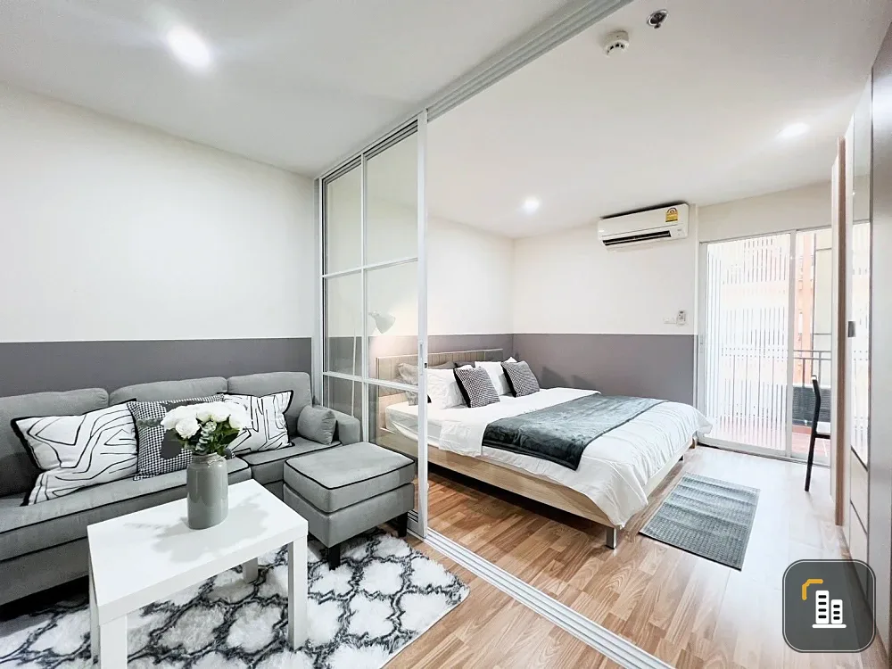 For sale or rent: Regent Home 12 Ladprao 41. The unit is on the 6th floor, next to the elevator, fire escape, and garbage room. It's very breezy; even