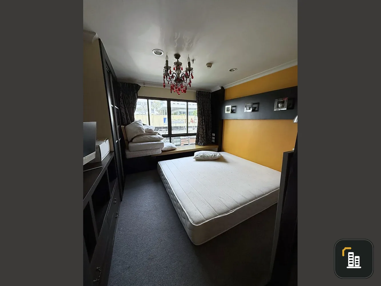 For rent: Lumpini Place Rama VIII, beautifully decorated unit with a coordinated color scheme, featuring a large, inviting red sofa. Don't miss out!