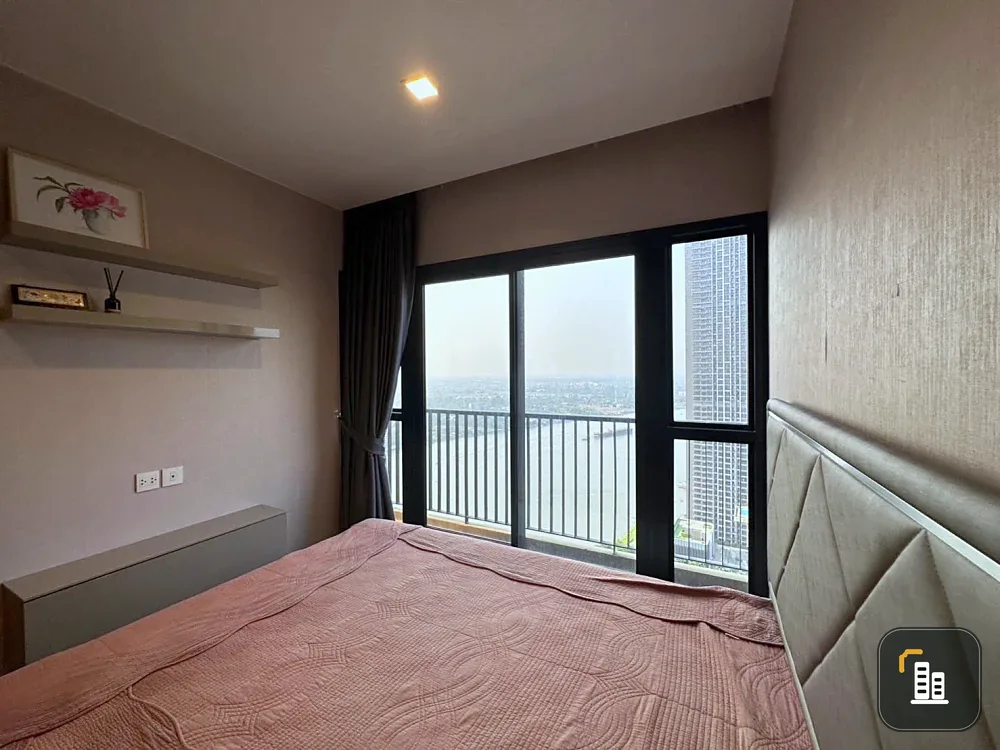 Condo for rent at Politan Rive, corner unit overlooking the Chao Phraya River, 31st floor, fully furnished. Book now!