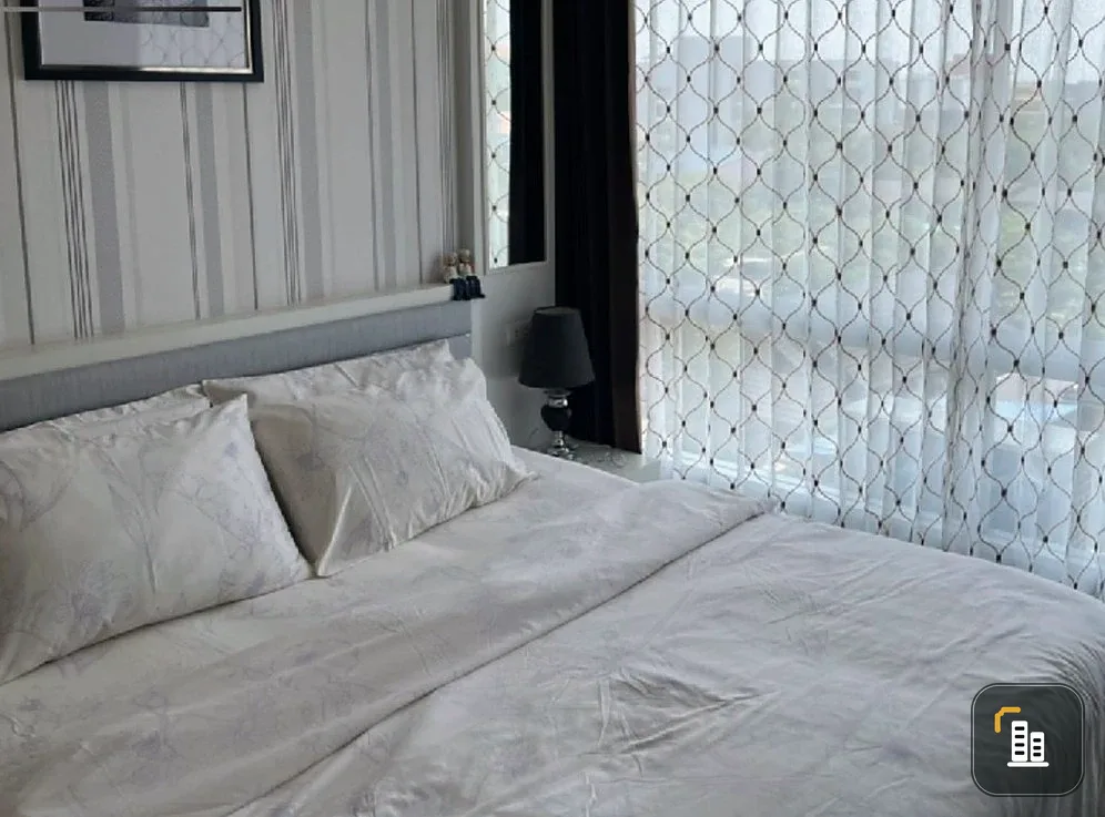 Selling The Patio Bangsaen, corner unit offering privacy, 5th floor, high-quality wallpaper, fully furnished with appliances. Book now!