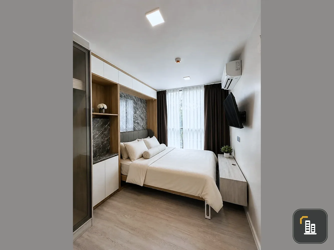 For rent: Atmoz Tropicana Bangna condo, corner unit, tree-lined view, private, quiet, and well-ventilated. Book now!