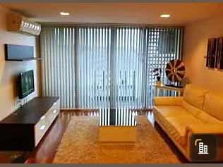 Modern 2-bedroom apartment for rent at DLV Thonglor. Spacious living room with open kitchen. You can't miss this!