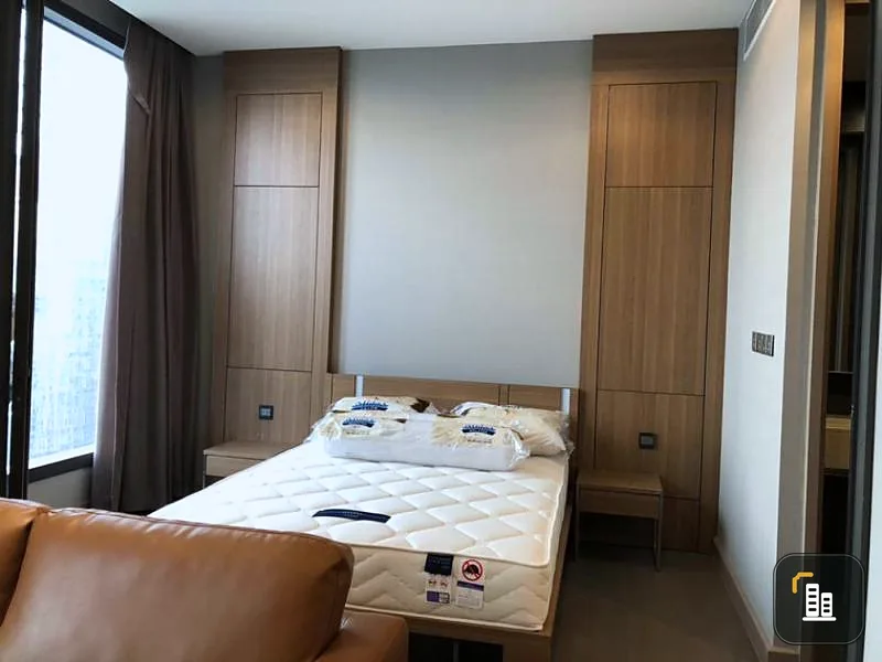 The Esse at Singha Complex For rent Bedroom in brown tones look warm Tell me if you miss it and you'll regret it.